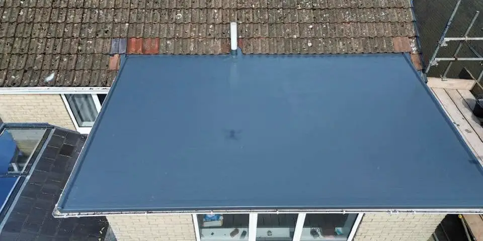 A flat roof re-covered in a smooth grey membrane, seen from above